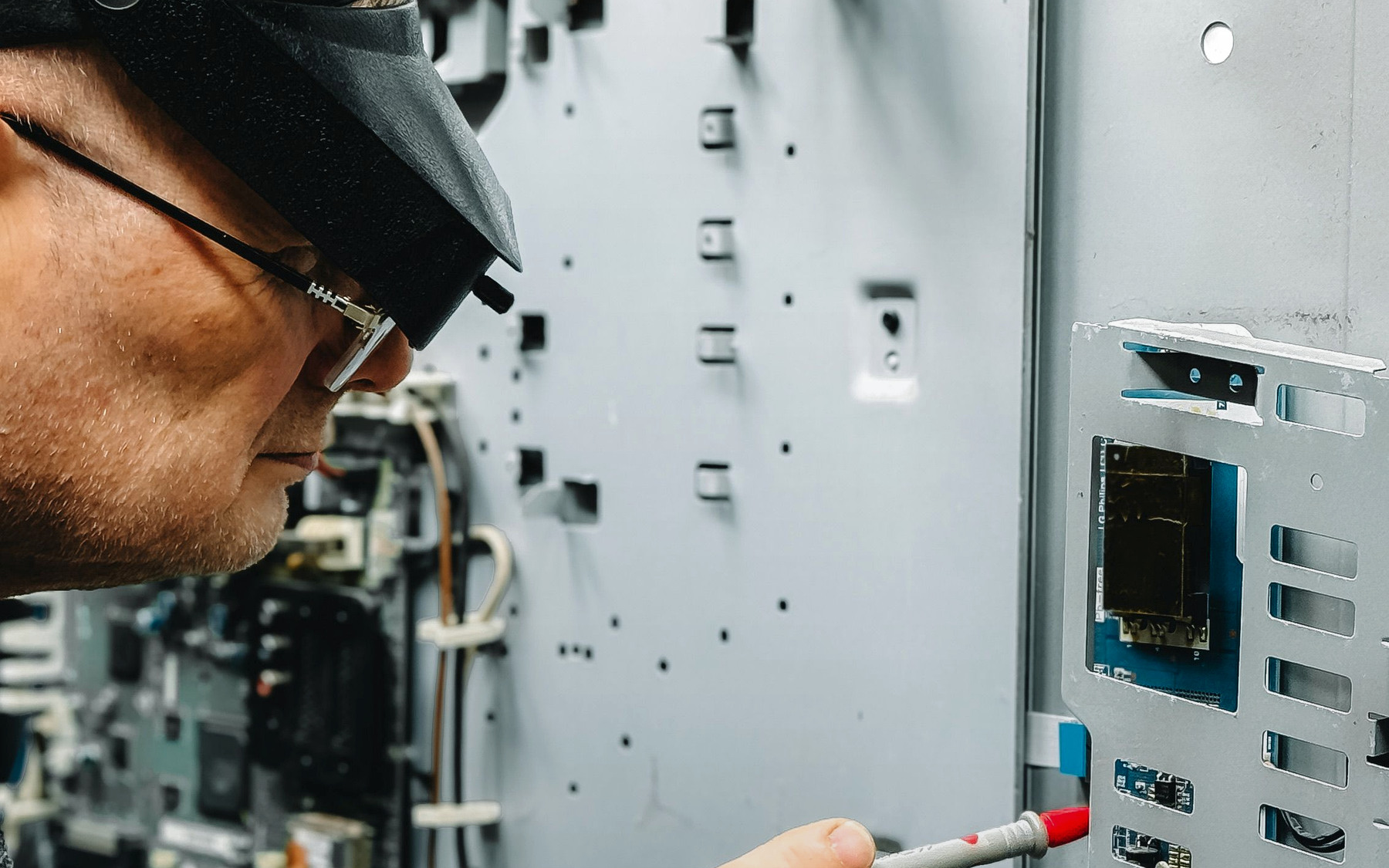 Photograph of a technician inspecting industrial equipment